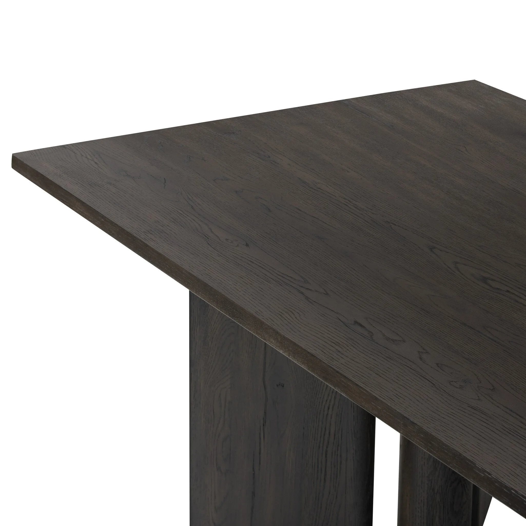 A smoked black finish brings character to this substantially sized dining table. Angled panel legs separated by a round cylinder craft a geometric look.Collection: Haide Amethyst Home provides interior design, new home construction design consulting, vintage area rugs, and lighting in the Miami metro area.