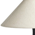 Cast aluminum forms a candlestick-inspired base, accented with uniquely shaped legs. A tapered linen shade offers a sleek finishing detail.Collection: Ashe Amethyst Home provides interior design, new home construction design consulting, vintage area rugs, and lighting in the Dallas metro area.