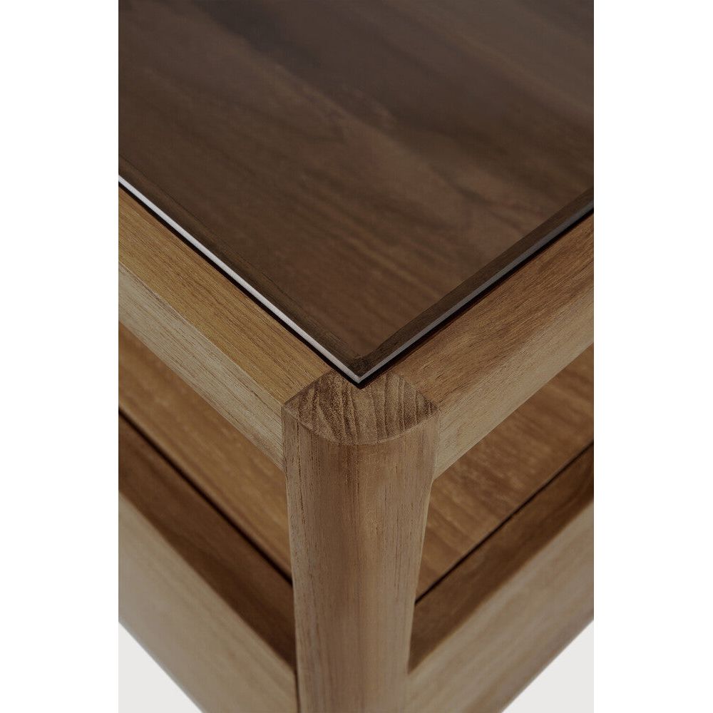 With its one drawer, open space and slightly tapered legs, the Spindle bedside table is the perfect no-nonsense companion for the striking Spindle bed. Reclaimed teak offers a truly unique finish for each and every item — the origin of each hand-finished piece of furniture carries its own story in its material. Amethyst Home provides interior design, new home construction design consulting, vintage area rugs, and lighting in the Houston metro area.