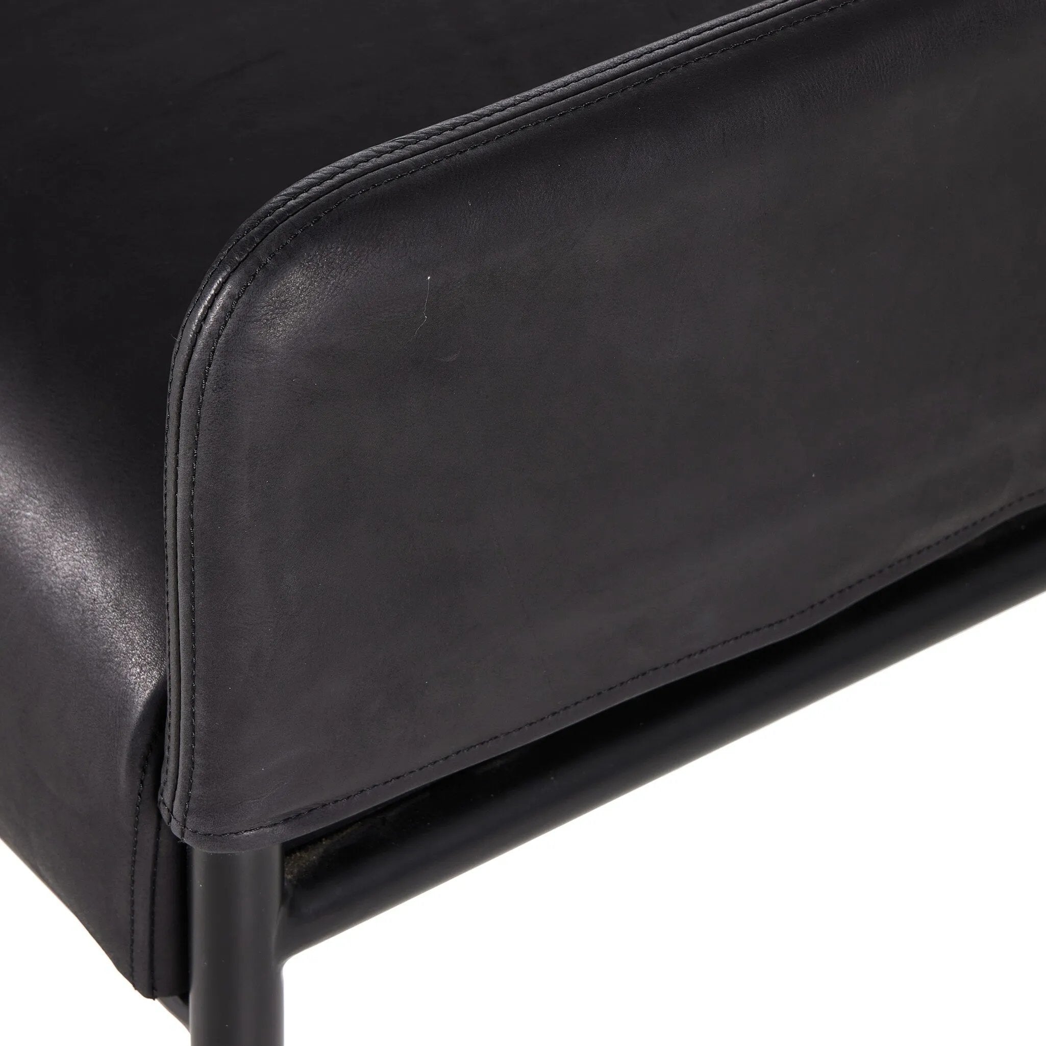 Black top-grain leather steals the show in this sleek, simple bench. Sourced from one of the oldest family-owned tanneries in Italy's Bassano del Grappa, heirloom leather is salvaged and processed from upcycled hides featuring an abundance of natural markings, scars and color variations. Amethyst Home provides interior design, new home construction design consulting, vintage area rugs, and lighting in the Laguna Beach metro area.