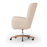 An executive-style chair is upholstered in a high-performance fabric, with subtle curves for a dramatic look and comfortable sit. Casters and seat heigh adjustability for ease in the modern office. Amethyst Home provides interior design, new construction, custom furniture, and area rugs in the San Diego metro area.