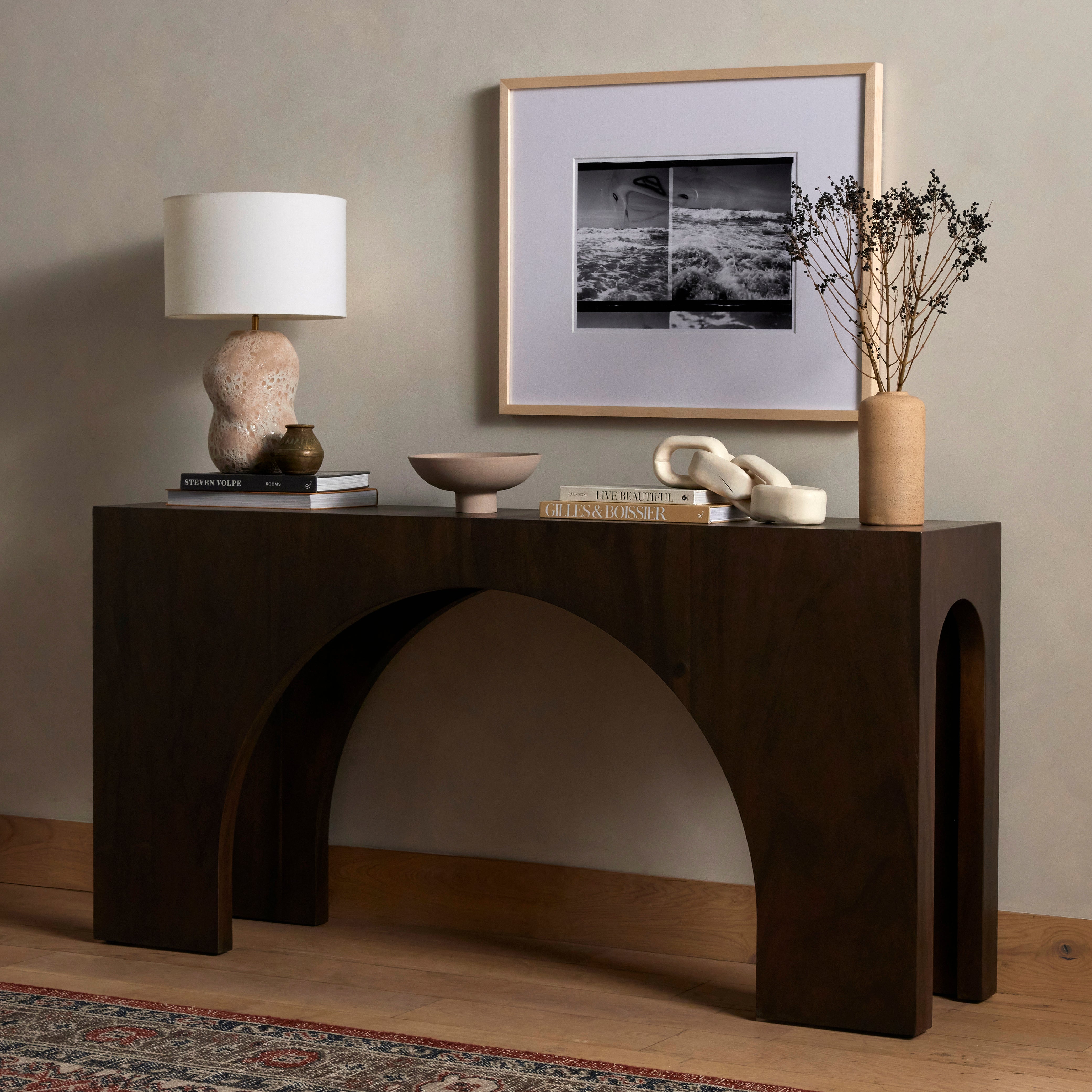 Clean and simple, with great impact. Made from smoked Guanacaste, shapely arches and block corners speak to the architectural inspiration behind this eye-catching console table. Amethyst Home provides interior design, new construction, custom furniture, and area rugs in the Kansas City metro area.