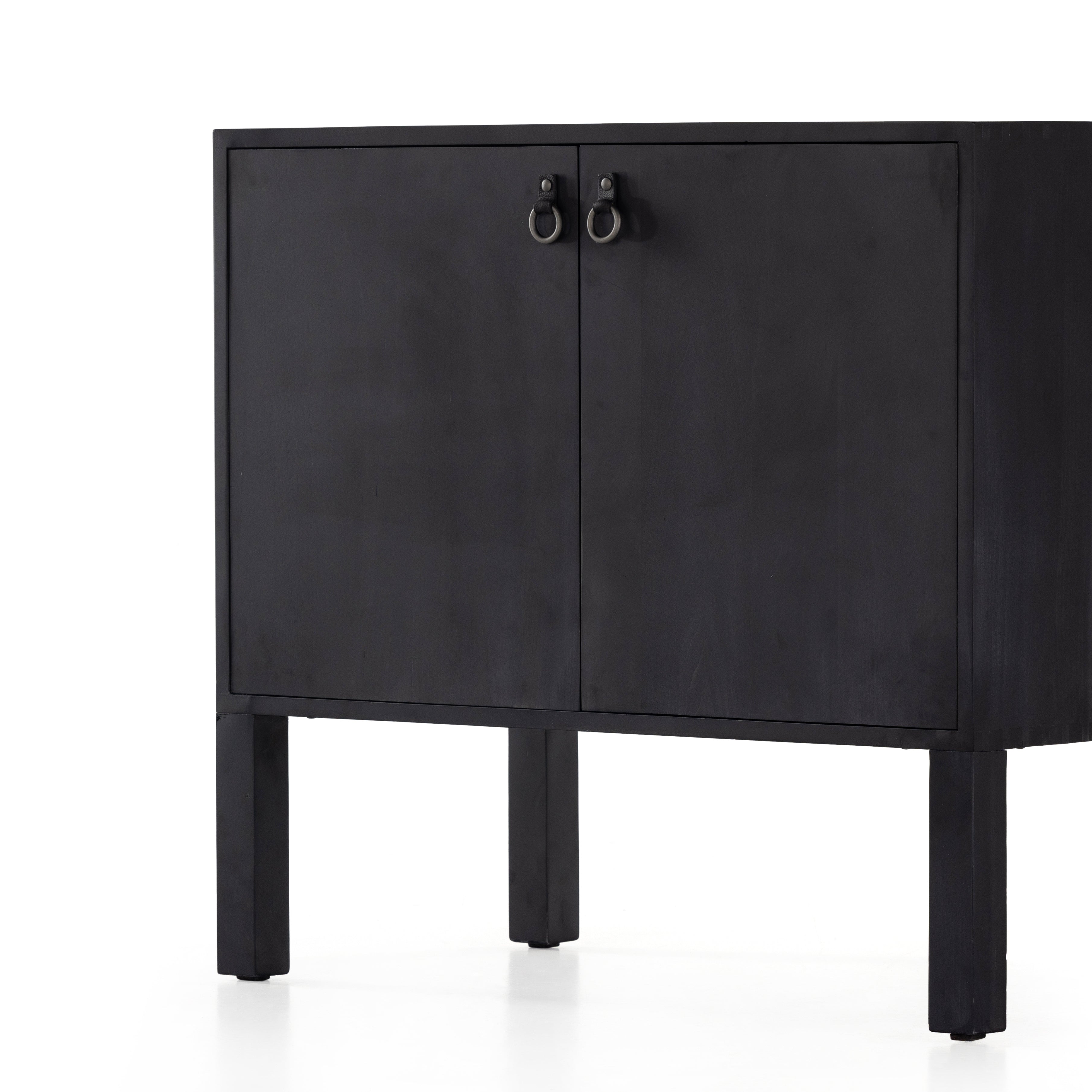 Beautifully simple in spirit. Black-washed solid poplar forms a Parsons-style bar cabinet, with iron and leather hardware for a material-driven update to Shaker-inspired styling. Inside, dual drawers plus generous bottle storage await drink go-tos and bar accessories. Amethyst Home provides interior design, new construction, custom furniture, and area rugs in the Des Moines metro area.