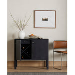 Beautifully simple in spirit. Black-washed solid poplar forms a Parsons-style bar cabinet, with iron and leather hardware for a material-driven update to Shaker-inspired styling. Inside, dual drawers plus generous bottle storage await drink go-tos and bar accessories. Amethyst Home provides interior design, new construction, custom furniture, and area rugs in the Kansas City metro area.