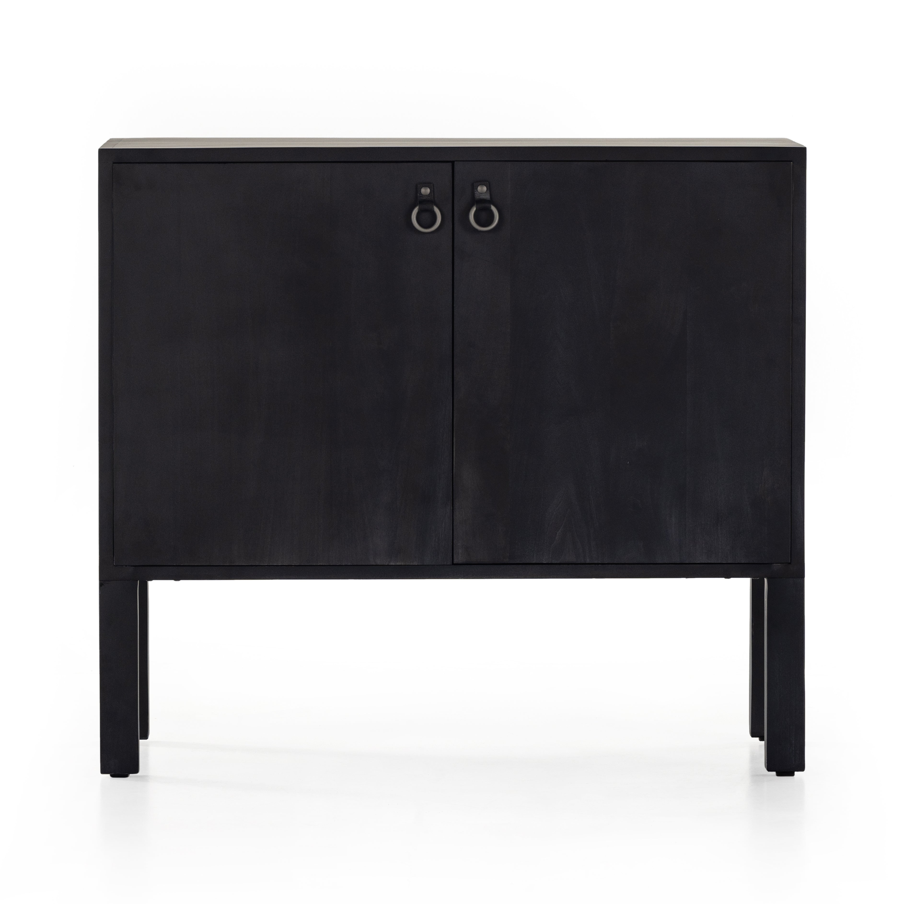 Beautifully simple in spirit. Black-washed solid poplar forms a Parsons-style bar cabinet, with iron and leather hardware for a material-driven update to Shaker-inspired styling. Inside, dual drawers plus generous bottle storage await drink go-tos and bar accessories. Amethyst Home provides interior design, new construction, custom furniture, and area rugs in the Washington metro area.
