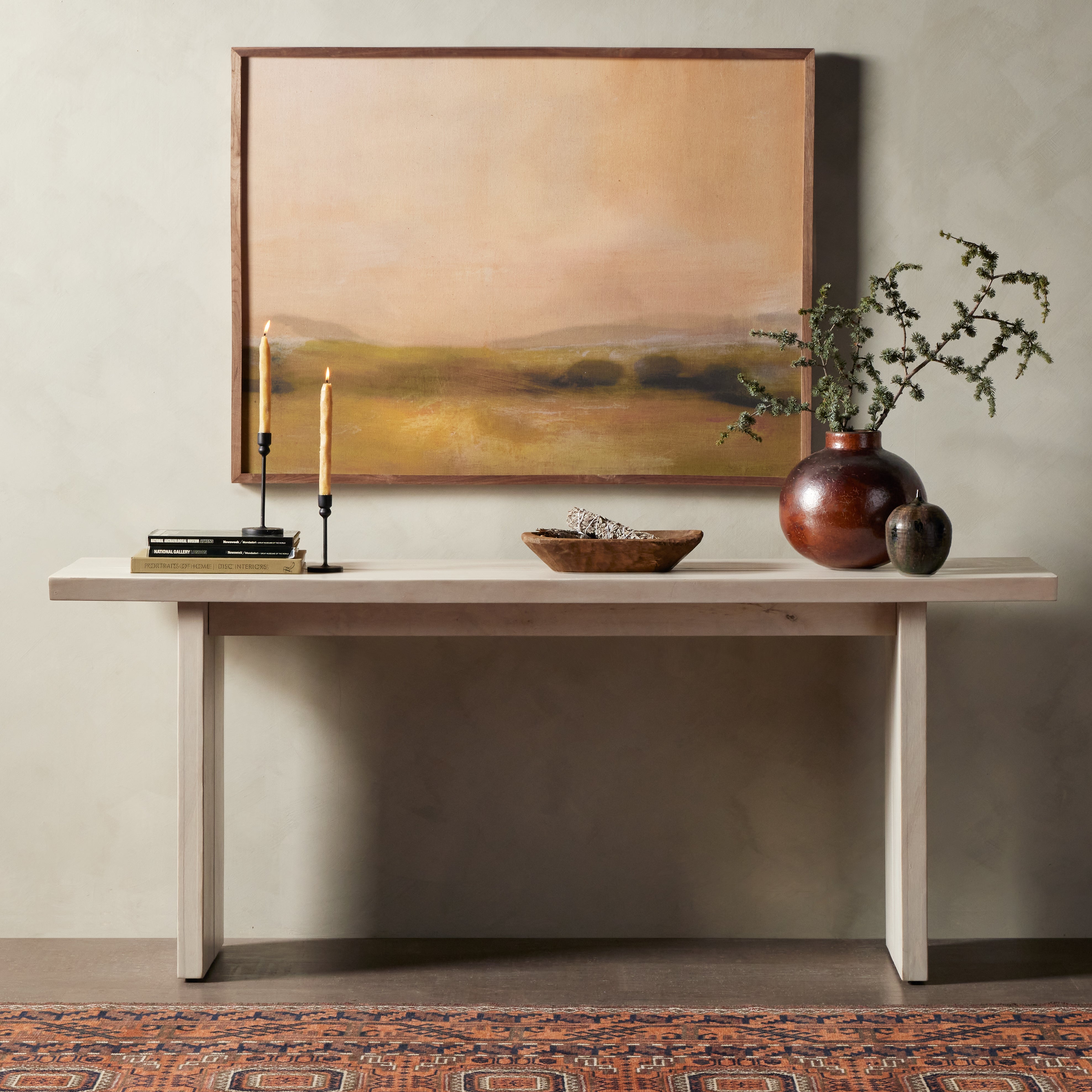 Made from bleached Guanacaste, a minimalist console table features live edging and split slab detailing. Light in look and finish, for versatility in any space or style. Amethyst Home provides interior design, new construction, custom furniture and area rugs in the Dallas metro area