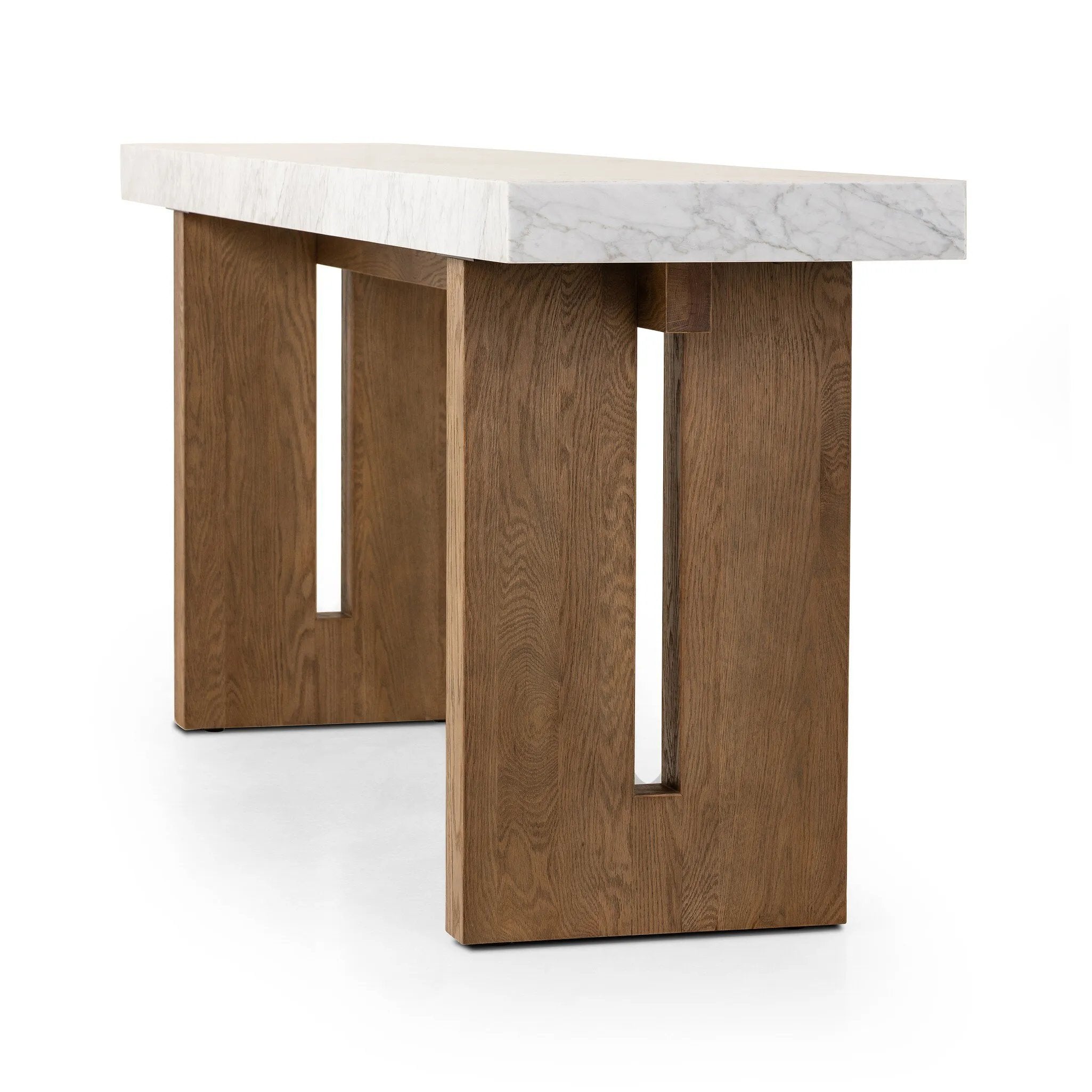 Structured and geometric, an open-style console table pairs smoked oak veneer with white marble, for a sophisticated material mix.Collection: Hughe Amethyst Home provides interior design, new home construction design consulting, vintage area rugs, and lighting in the Charlotte metro area.