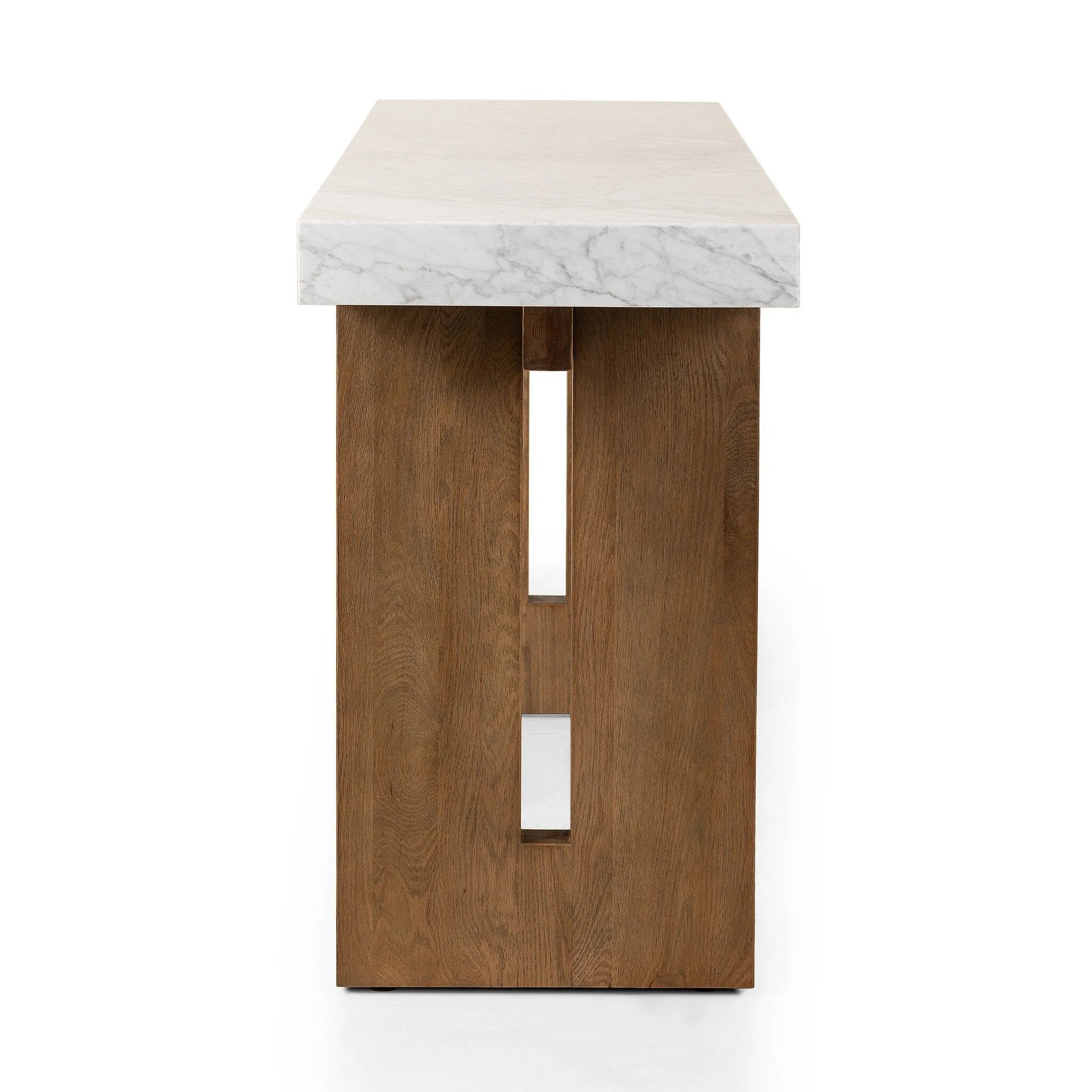 Structured and geometric, an open-style console table pairs smoked oak veneer with white marble, for a sophisticated material mix.Collection: Hughe Amethyst Home provides interior design, new home construction design consulting, vintage area rugs, and lighting in the Omaha metro area.