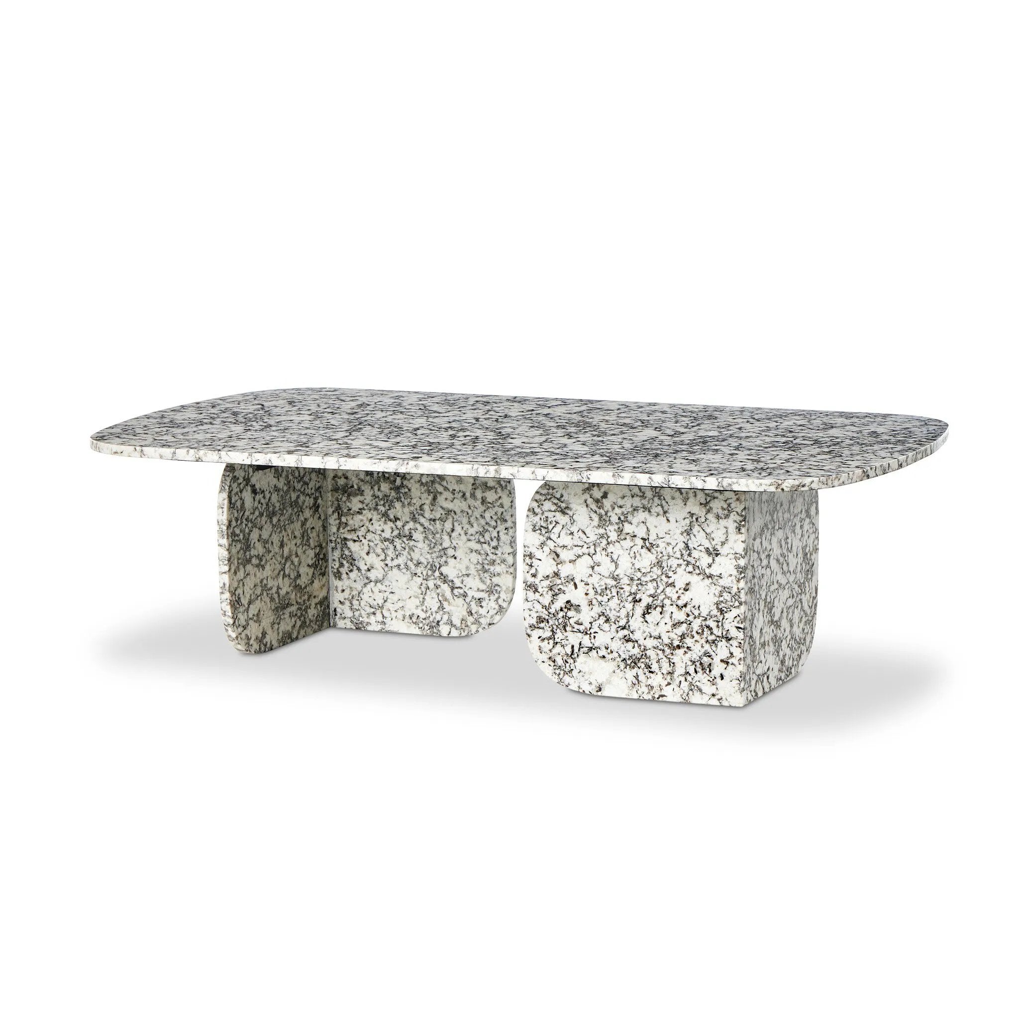 Speckled black marble shapes a unique coffee table with softened corners and subtle Eighties vibes.Collection: Marlo Amethyst Home provides interior design, new home construction design consulting, vintage area rugs, and lighting in the Alpharetta metro area.
