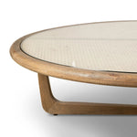 Materials mingle in this rounded coffee table of warm solid oak, natural cane and tempered glass. A Y-shaped base reflects midcentury inspiration.Collection: Irondal Amethyst Home provides interior design, new home construction design consulting, vintage area rugs, and lighting in the Portland metro area.