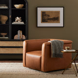 Inspired by 70s vintage seating and plush duvet toppers, a structured, supportive seat is covered in a Four Hands-exclusive top-grain leather in a rich cognac tone. A 360-degree swivel modernizes this vintage-leaning look. Amethyst Home provides interior design, new construction, custom furniture, and area rugs in the Omaha metro area.