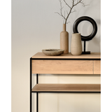 Balance and function come together in the Monolit console table. This simple, sleek table includes storage and we LOVE hidden storage! Dress up your living room or office with a piece that is both functional and stylish!  Dimensions: 48.5"w x 16"d x 33.5"h  Weight: 77 lbs  Material: Oak, 100% solid wood Finish: Oiled