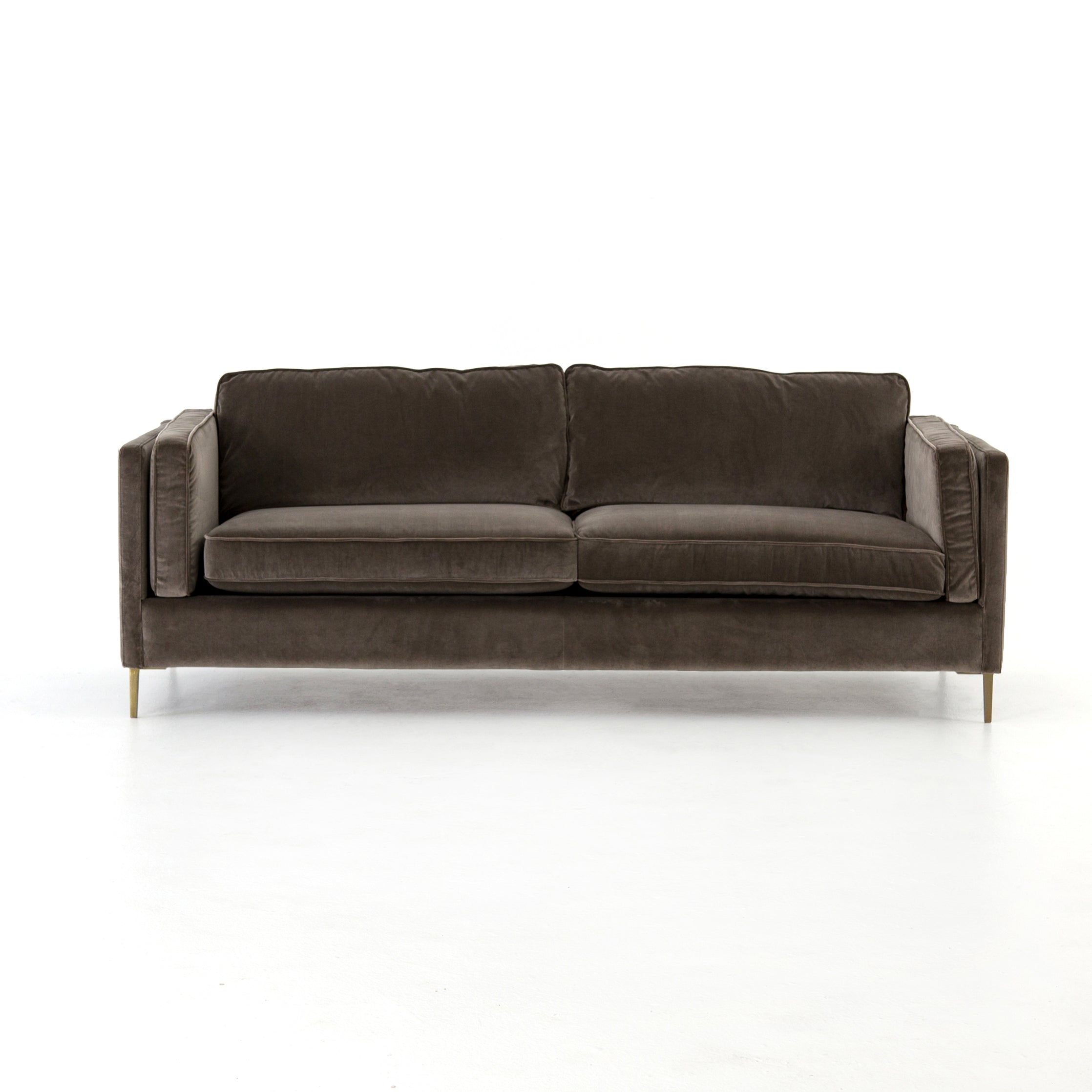 We love the plush brich-grey upholstery of this Emery Sofa - Sapphire Birch. The slim legs are finished in a gorgeous antique brass, for a sophisticated look for any living room or lounge area.   Overall Dimensions: 84.00"w x 36.00"d x 33.00"h