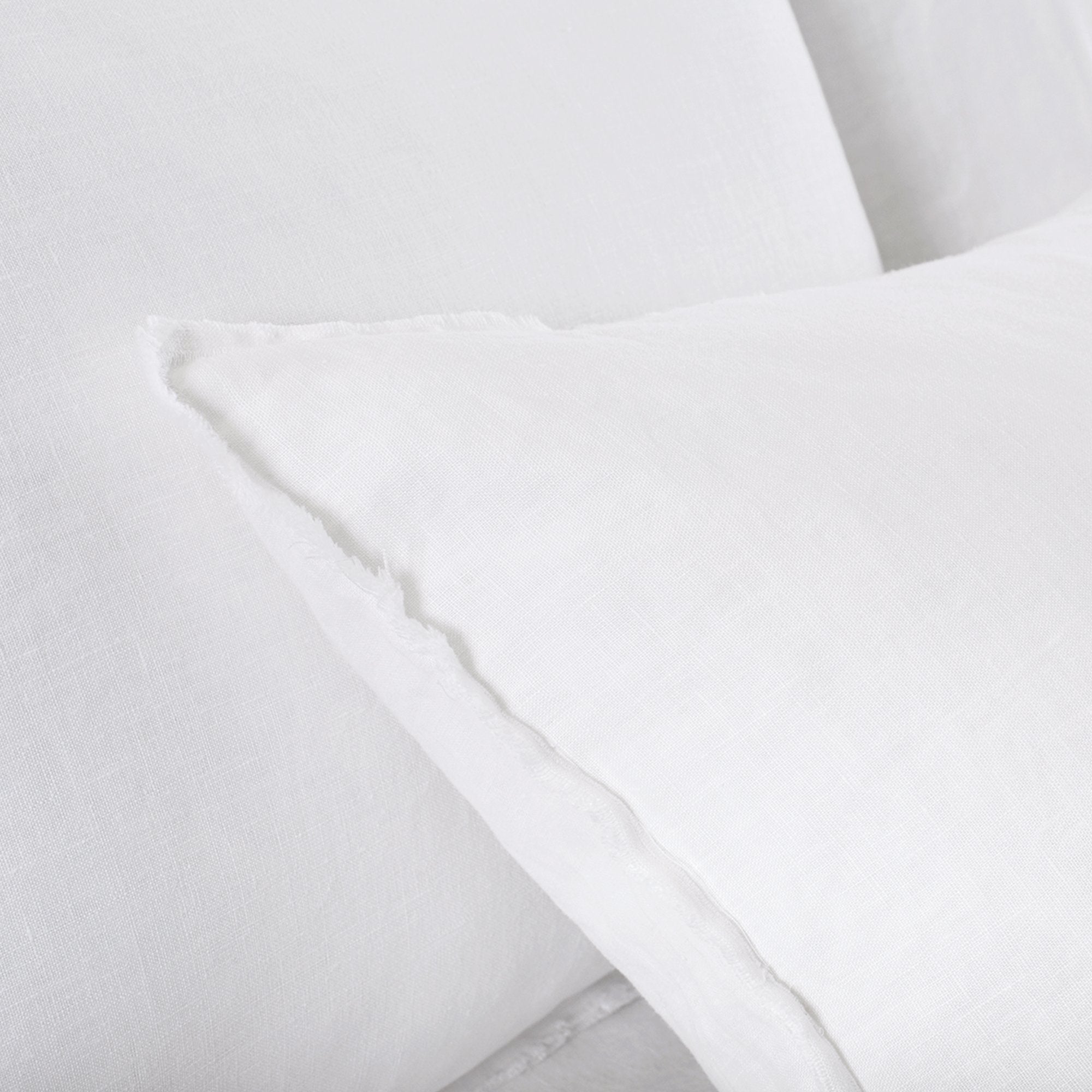 This Blair White Duvet Collection by Pom Pom at Home is youthful and casual with subtle frayed edges. Made of 100% linen, the duvet cover and shams are finished with simple tie closures.  Inserts sold separately  100% linen Machine wash cold; tumble dry low; warm iron as needed Do not bleach