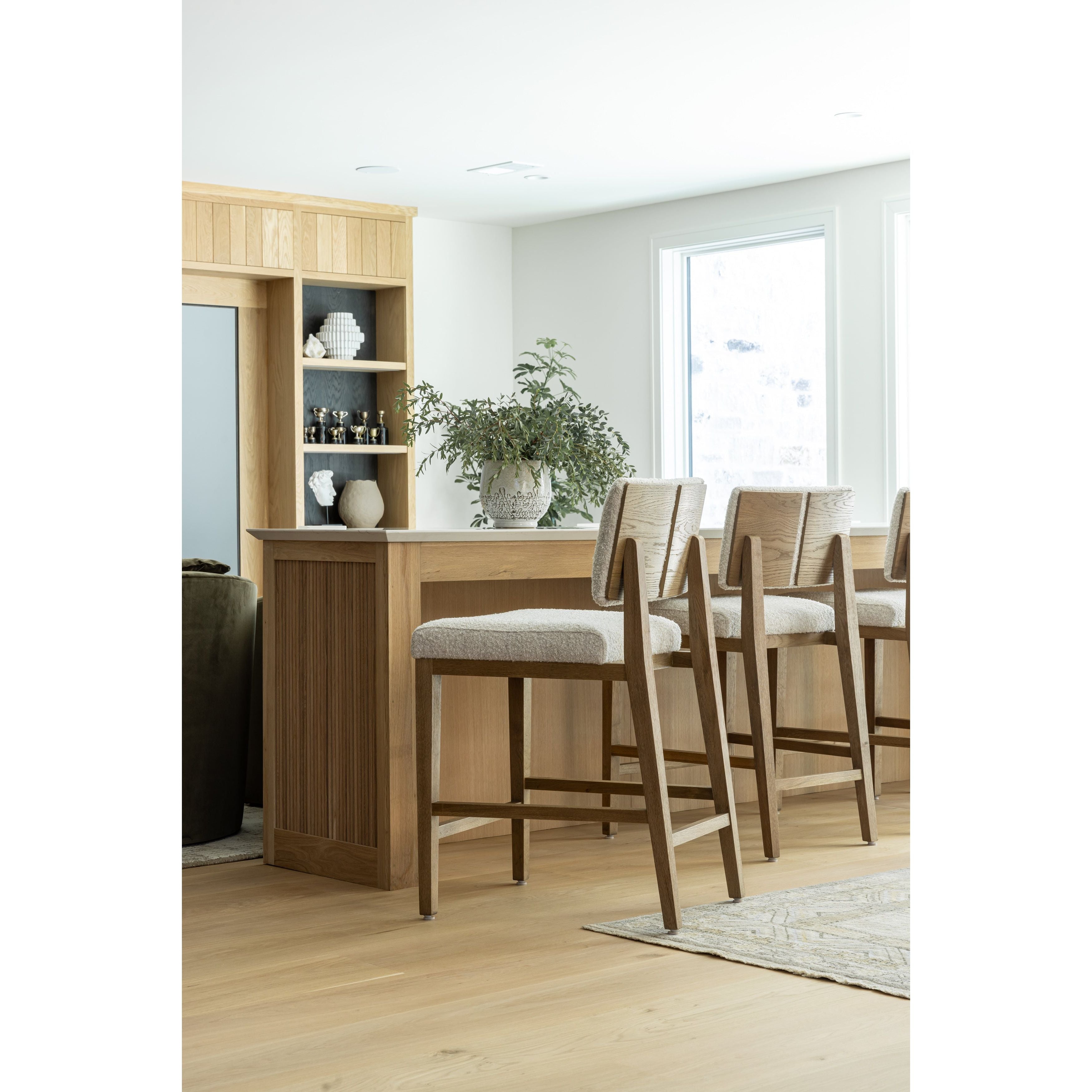 Featuring Charles Somerton Ash Counter Stool by Four Hands at Amethyst Home. This stool is all about the textile -- gorgeous French inspired boucle with a cool toned oak base.  Gorgeous back detail makes this Charles stool attractive from all angles.
Overall Dimensions: 25.5" L x 20.75 " W x 39.5" HClearance from Floor 16.75"Distance between Legs (Front to Bac. Amethyst Home provides interior design, new home construction design consulting, vintage area rugs, and lighting in the Austin metro area.