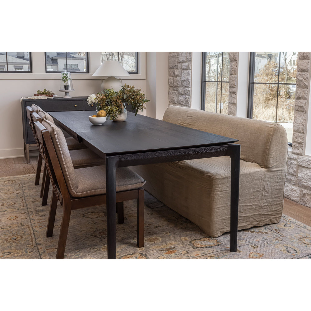 Featuring Wilmington Alcala Fawn Dining Chair by Four Hands at Amethyst Home. An Amethyst fave -- the Wilmington dining chair has a gorgeous coffee colored textile paired with medium toned wood and interesting leather buckles on the back -- we tied in the gold buckles with the gold chandelier above!  Inspired by the folded pillow form, the seat and back. Amethyst Home provides interior design, new home construction design consulting, vintage area rugs, and lighting in the Newport Beach metro area.