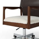 Sleek, streamlined midcentury vibe. Desk chair features a faux leather seatback and a faux shearling seat in liquid-repellent performance fabric. Subtly curved arms, frame and legs made of solid ash wood atop a 360 swivel. Performance fabrics are specially created to withstand spills, stains, high traffic and wear, ensuring long-term comfort and unmatched durability. Amethyst Home provides interior design, new home construction design consulting, vintage area rugs, and lighting in the Atlanta metro area.