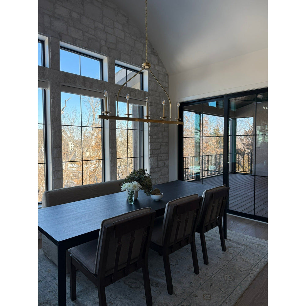 Featuring Wilmington Alcala Fawn Dining Chair by Four Hands at Amethyst Home. An Amethyst fave -- the Wilmington dining chair has a gorgeous coffee colored textile paired with medium toned wood and interesting leather buckles on the back -- we tied in the gold buckles with the gold chandelier above!  Inspired by the folded pillow form, the seat and back cu. Amethyst Home provides interior design, new home construction design consulting, vintage area rugs, and lighting in the Scottsdale metro area.