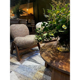 The Cosmo Chair features a modern, sculpted design with a generously supportive yet soft back and seat, all supported by a sleek, solid wooden frame. Amethyst Home provides interior design, new home construction design consulting, vintage area rugs, and lighting in the Monterey metro area.