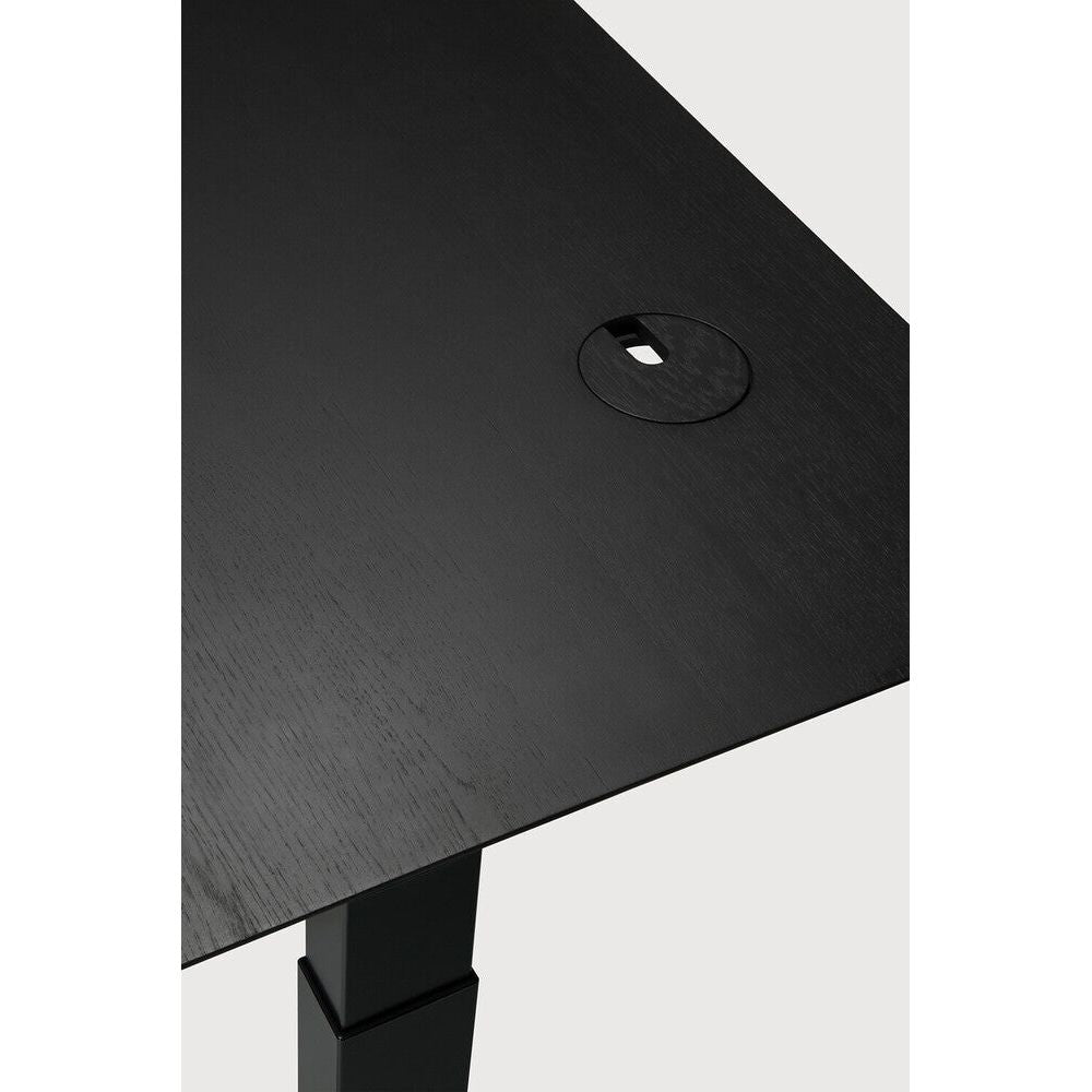 Featuring Bok Black Us Oak Black Adjustable Desk by Ethnicraft at Amethyst Home. The Bok adjustable desk was designed with the importance of health and good posture in mind. The motorised system in its legs allows the tabletop to be elevated to the height of your liking. That way, you can easily switch between sitting and standing throughout the workday. Choose between white or black . Amethyst Home provides interior design, new construction, custom furniture, and area rugs in the Miami metro area