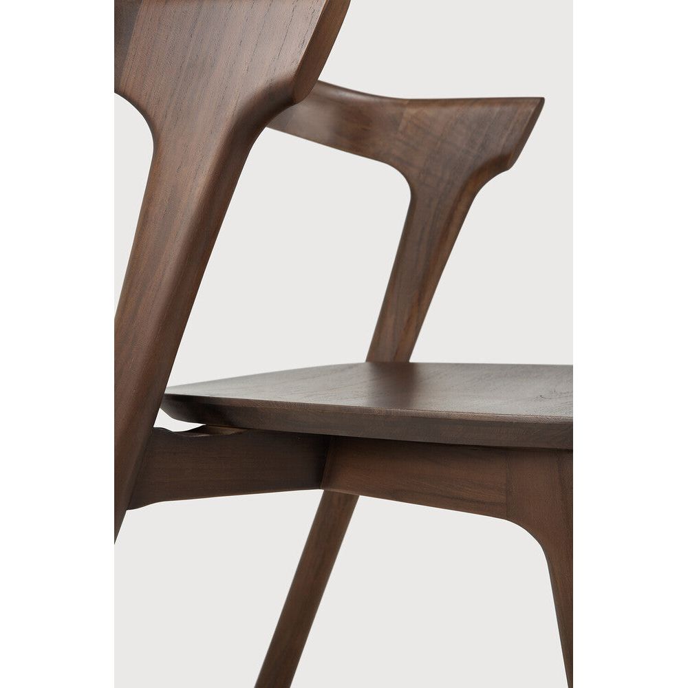 Featuring Bok No Upholstery Varnished Teak Brown Dining Chair by Ethnicraft at Amethyst Home. Reminiscent of a goat's curved horns, the Bok collection combines sculptural elegance and contemporary crafting into a graceful and airy form. Over the years, the Bok dining chair has become one of Ethnicraft's most recognisable designs.Weight : 33 lb Dimensions: 24.5 in W x 23 in L x. Amethyst Home provides interior design, new construction, custom furniture, and area rugs in the Newport Beach metro area
