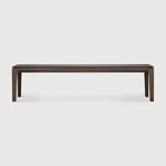 Featuring Bok Oak Brown Bench by Ethnicraft at Amethyst Home. Reminiscent of a goat's curved horns, the Bok collection combines sculptural elegance and contemporary crafting into a graceful and airy form. The Bok bench pairs well with the Bok dining table, but also as a stand-alone against a wall, in a hallway or at the end of a bed.Collection : BokFinish : VarnishedFloor Prot. Amethyst Home provides interior design, new construction, custom furniture, and area rugs in the Newport Beach metro area