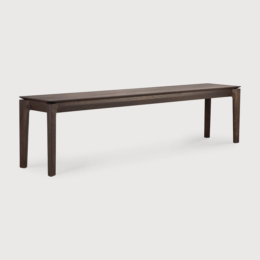 Featuring Bok Oak Brown Bench by Ethnicraft at Amethyst Home. Reminiscent of a goat's curved horns, the Bok collection combines sculptural elegance and contemporary crafting into a graceful and airy form. The Bok bench pairs well with the Bok dining table, but also as a stand-alone against a wall, in a hallway or at the end of a bed.Collection : BokFinish : VarnishedFloor Protect. Amethyst Home provides interior design, new construction, custom furniture, and area rugs in the Scottsdale metro area