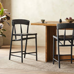 Featuring Buxton Black Rush Bar + Counter Stool by Four Hands at Amethyst Home. A solid oak counter stool defined by tapered legs and framing gives an updated look to the classic whistler chair. Finished with a paper rush wrapped detail on the back.BarOverall Dimensions: 19.25"w x 22.25"d x 42.75"hWeight: 23.70 lbsCounterOverall Dimensions: 19.50"w x 22.25"d x 38.75"hWeight: 21.61. Amethyst Home provides interior design, new construction, custom furniture, and area rugs in the Calabasas metro area