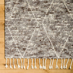 The Camille Jasper Wolf hand-knotted rug features a yummy blend of charcoal greys and chocolate brown.  Soft to the touch and made of dreamy, knotted wool in a low shed blend. Amethyst Home provides interior design, new home construction design consulting, vintage area rugs, and lighting in the Winter Garden, Florida metro area.