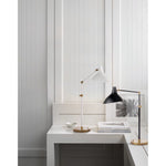 Featuring Charlton Table Lamp Black and Brass by Visual Comfort at Amethyst Home. The Charlton by AERIN delivers both practicality and elegance. The functional pieces illuminate walls, floors, or ceilings and offer limitless angles of illumination thanks to extended arms that can bend and reach as needed. Pivoting, curved shades can be customized with several brass or matte finis. Amethyst Home provides interior design, new construction, custom furniture, and area rugs in the Scottsdale metro area