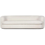 Featuring Clarissa Sofa by Four Hands at Amethyst Home. Organic curves with a dreamy French inspired boucle fabric -- the Clarissa sofa is an Amethyst favorite.  The sleek single seat cushion with firm back provides luxe comfort.
Overall Dimensions: 95.00"w x 37.50"d x 27.50"hWeight : 131.39 lbMaterials : 47% Polyester, 18% Viscose, 30% Acrylic, 5% Linen. Amethyst Home provides interior design, new home construction design consulting, vintage area rugs, and lighting in the Laguna Beach metro area.