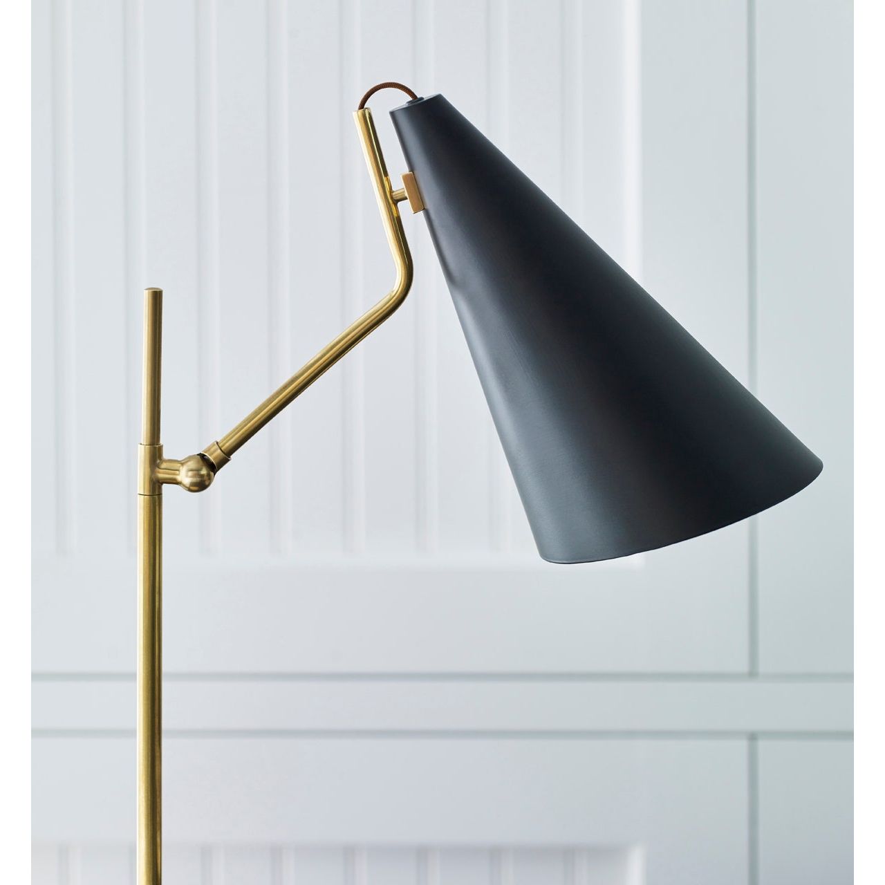 Featuring Clemente Table Lamp Brass with Black by Visual Comfort at Amethyst Home. The Clemente by AERIN offers refined angles and sleek detailing while lighting with elegant simplicity. Elongated conical shades provide a modern balance to a mid-century design with antique brass finishes. Any hallway or library will be enhanced with the Clemente, especially behind a favorite readi. Amethyst Home provides interior design, new construction, custom furniture, and area rugs in the Nashville metro area