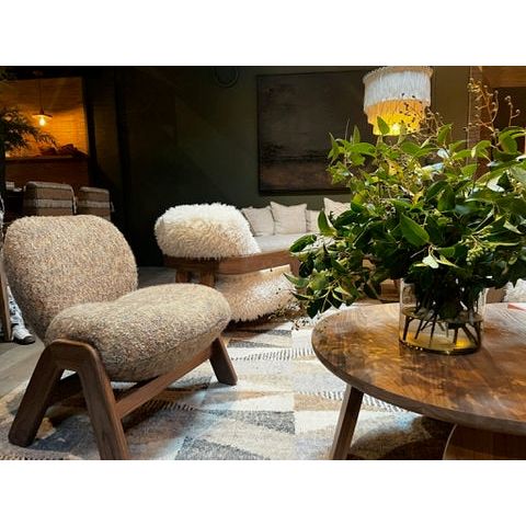 The Cosmo Chair features a modern, sculpted design with a generously supportive yet soft back and seat, all supported by a sleek, solid wooden frame. Amethyst Home provides interior design, new home construction design consulting, vintage area rugs, and lighting in the Washington metro area.