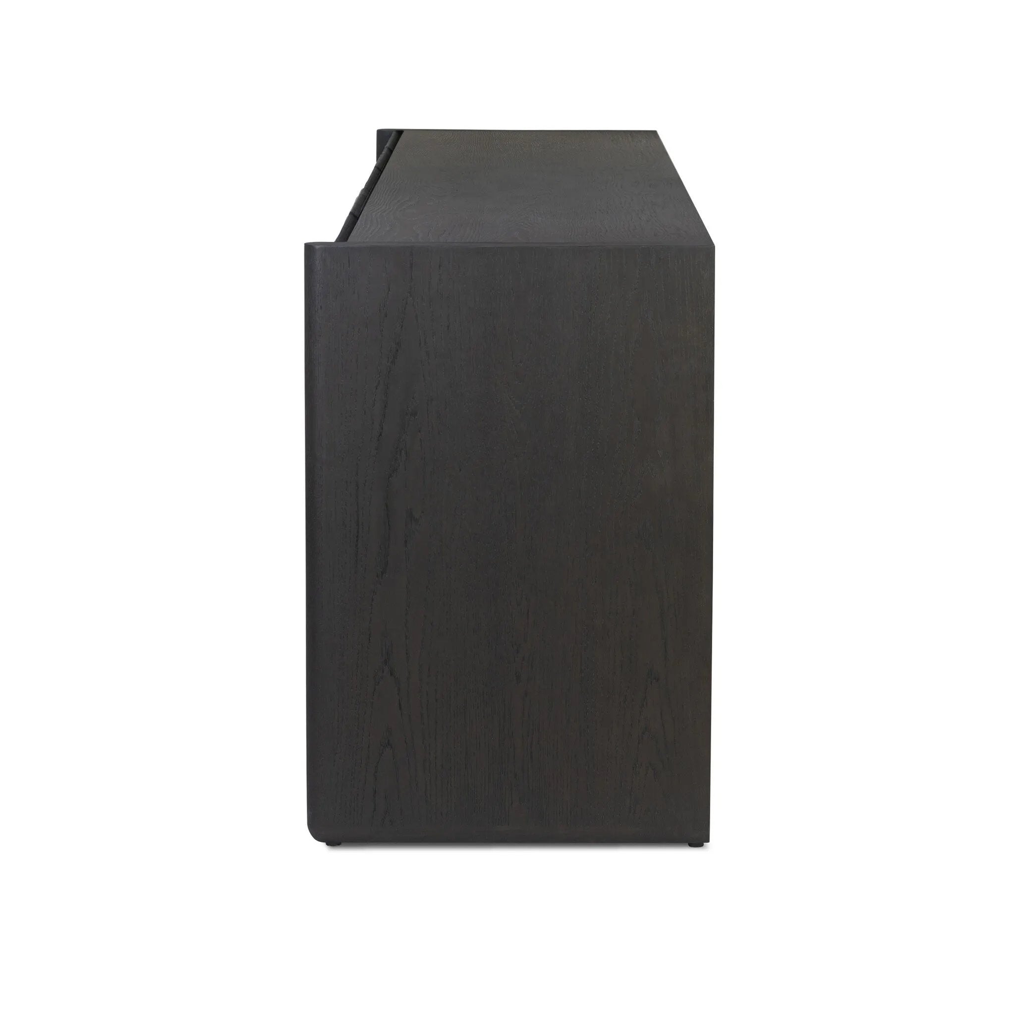 As lovers of wabi sabi aesthetics at Amethyst, we love the warm modern inspired Swell Sideboard - Dry Black Oak Veneer. This item pairs well with other brands such as Cisco Home and is perfect for coastal homes Amethyst Home provides interior design, new home construction design consulting, vintage area rugs, and lighting in the Salt Lake City metro area.