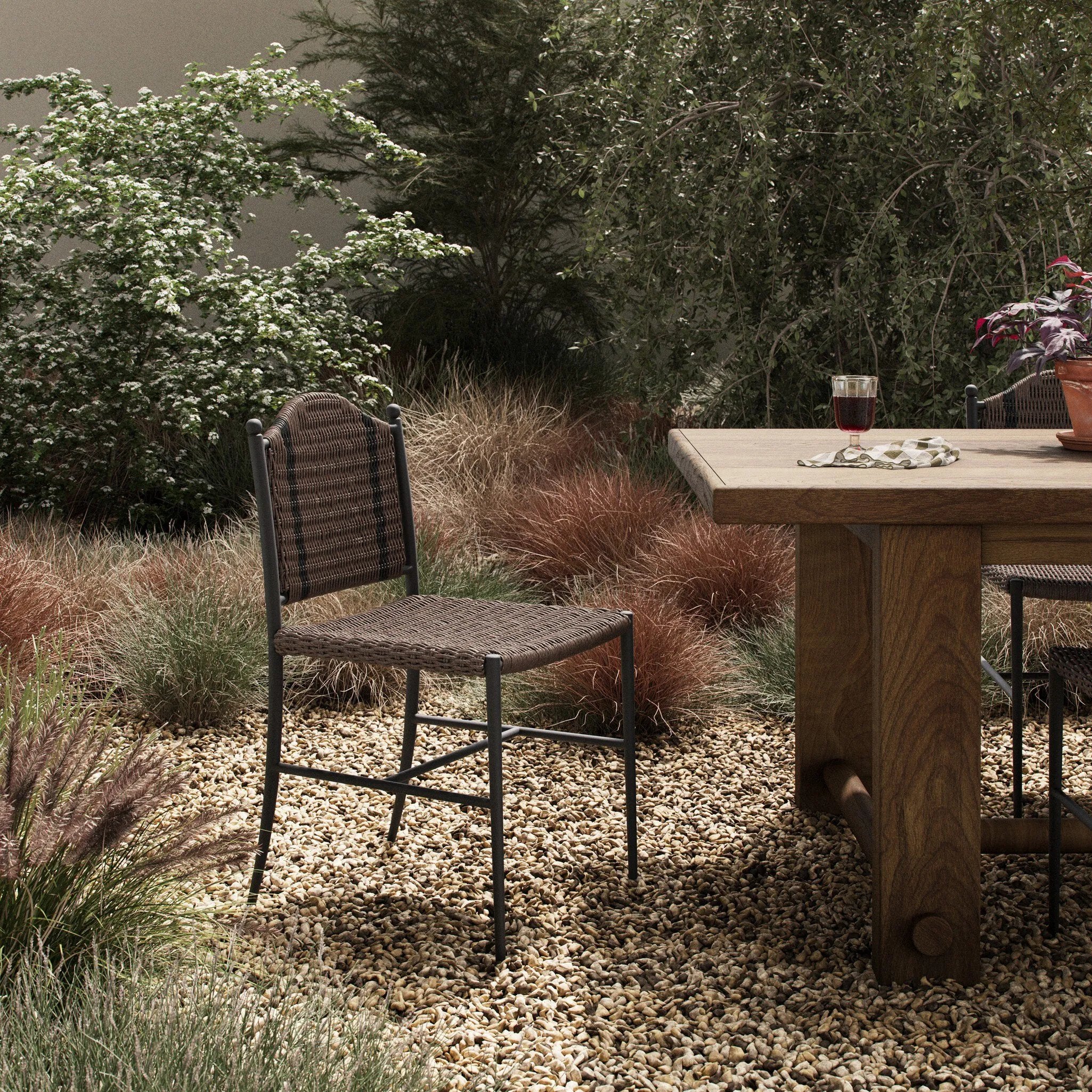 A bistro-style outdoor dining chair, merging a timeless profile with a unique stripe detail woven into the back. Finial details finish the dark bronze frame. Cover or store indoors during inclement weather and when not in use.As enthusiasts of luxe style at Amethyst, we love the nature inspired Abel Outdoor Dining Chair. Amethyst Home provides interior design, new home construction design consulting, vintage area rugs, and lighting in the Omaha metro area.