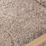 The perfect place to curl up with a good book. A hand-shaped parawood frame supports low, deep seating upholstered with taupe shearling Amethyst Home provides interior design, new home construction design consulting, vintage area rugs, and lighting in the Alpharetta metro area.