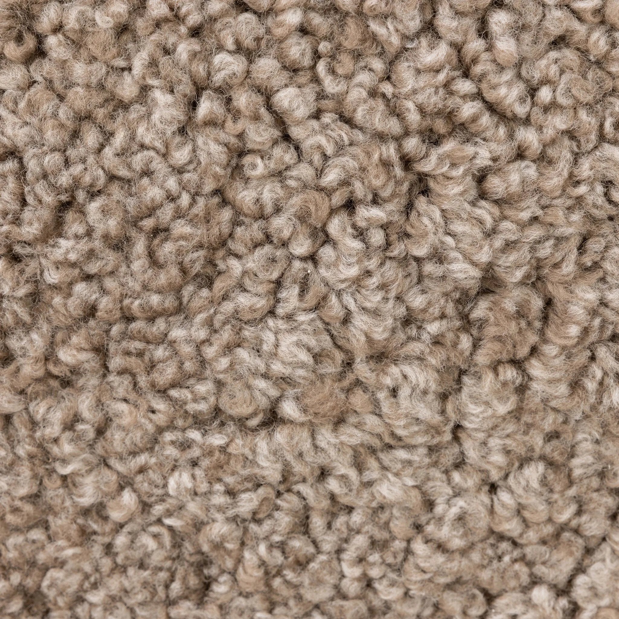 The perfect place to curl up with a good book. A hand-shaped parawood frame supports low, deep seating upholstered with taupe shearling Amethyst Home provides interior design, new home construction design consulting, vintage area rugs, and lighting in the Dallas metro area.