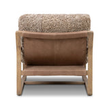 The perfect place to curl up with a good book. A hand-shaped parawood frame supports low, deep seating upholstered with taupe shearling Amethyst Home provides interior design, new home construction design consulting, vintage area rugs, and lighting in the Des Moines metro area.