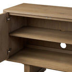 Store favorite dinnerware, table linens and more in this modernized Deco sideboard, with inverted chamfered framing and molding around the doors. Made from solid oak with a light, drifted finish and ski-style legs that elevate the whole piece Amethyst Home provides interior design, new home construction design consulting, vintage area rugs, and lighting in the Laguna Beach metro area.