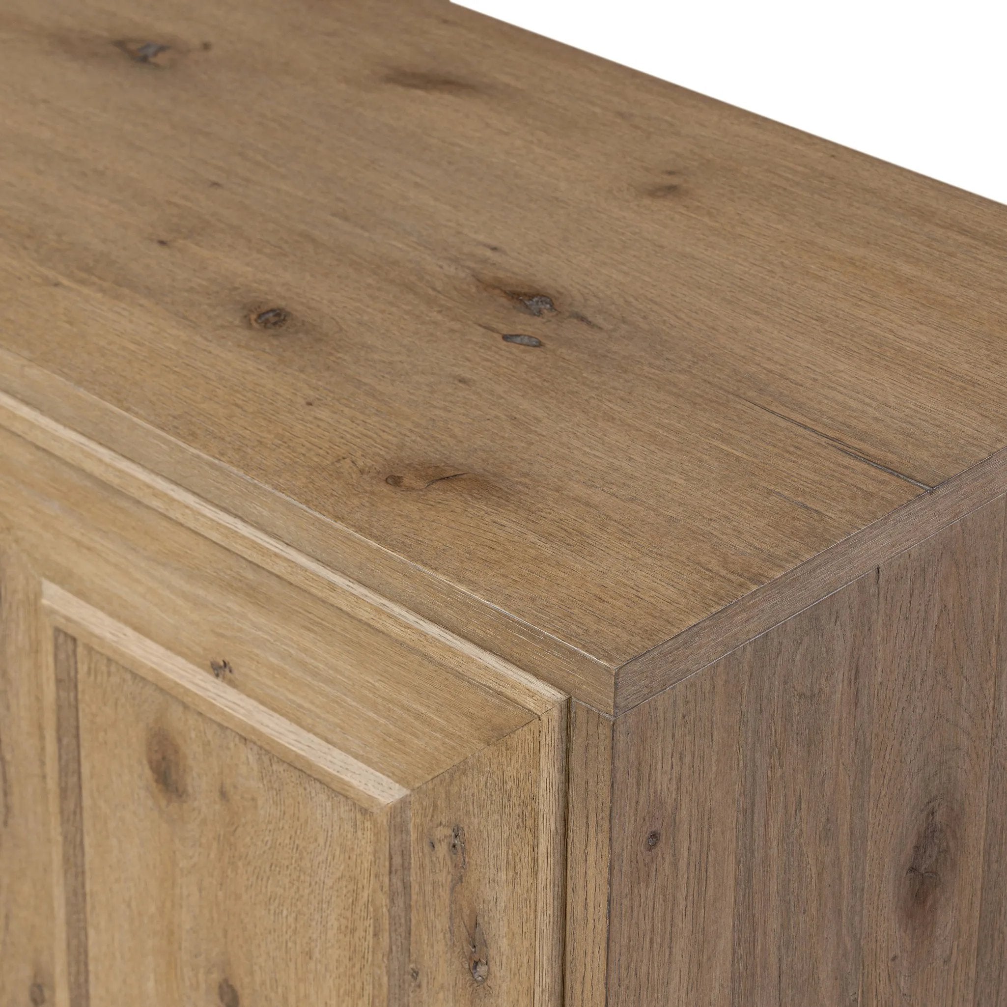 Store favorite dinnerware, table linens and more in this modernized Deco sideboard, with inverted chamfered framing and molding around the doors. Made from solid oak with a light, drifted finish and ski-style legs that elevate the whole piece Amethyst Home provides interior design, new home construction design consulting, vintage area rugs, and lighting in the Nashville metro area.