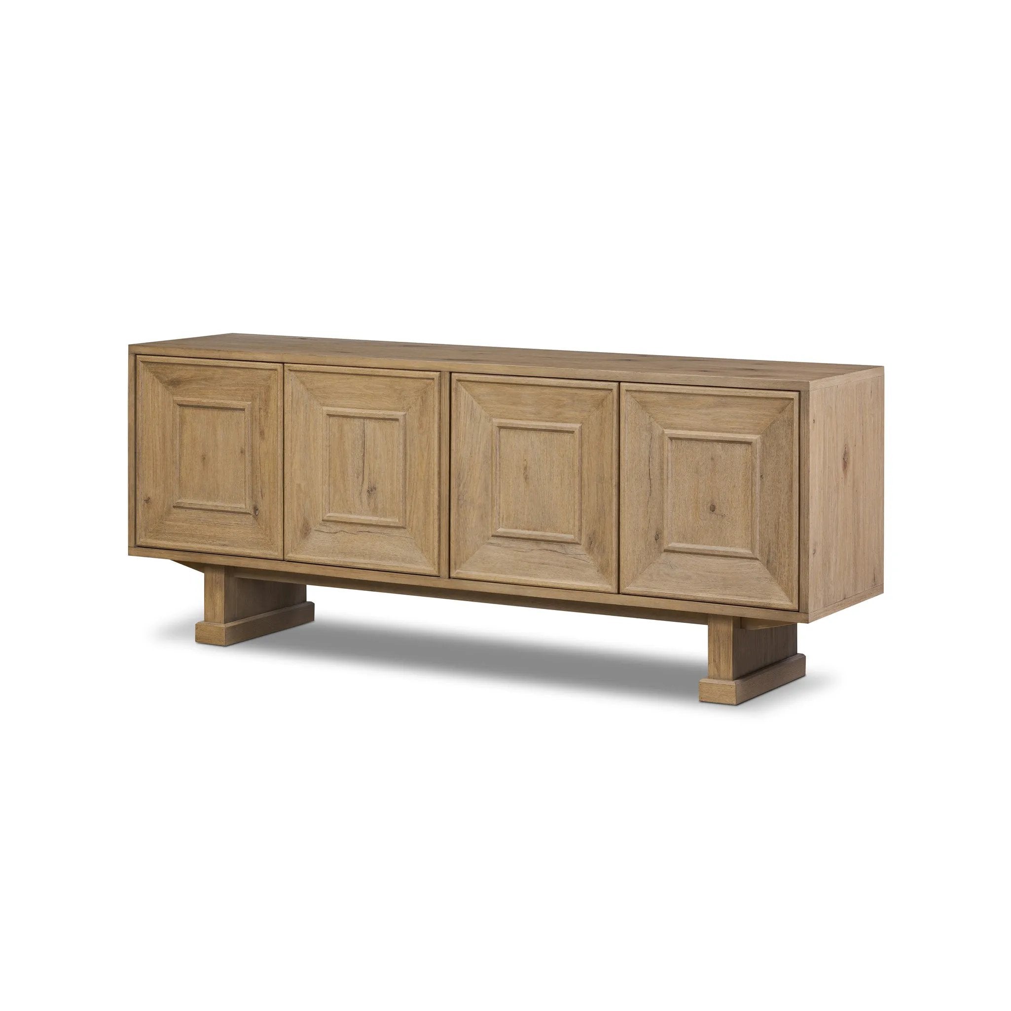 Store favorite dinnerware, table linens and more in this modernized Deco sideboard, with inverted chamfered framing and molding around the doors. Made from solid oak with a light, drifted finish and ski-style legs that elevate the whole piece Amethyst Home provides interior design, new home construction design consulting, vintage area rugs, and lighting in the Tampa metro area.