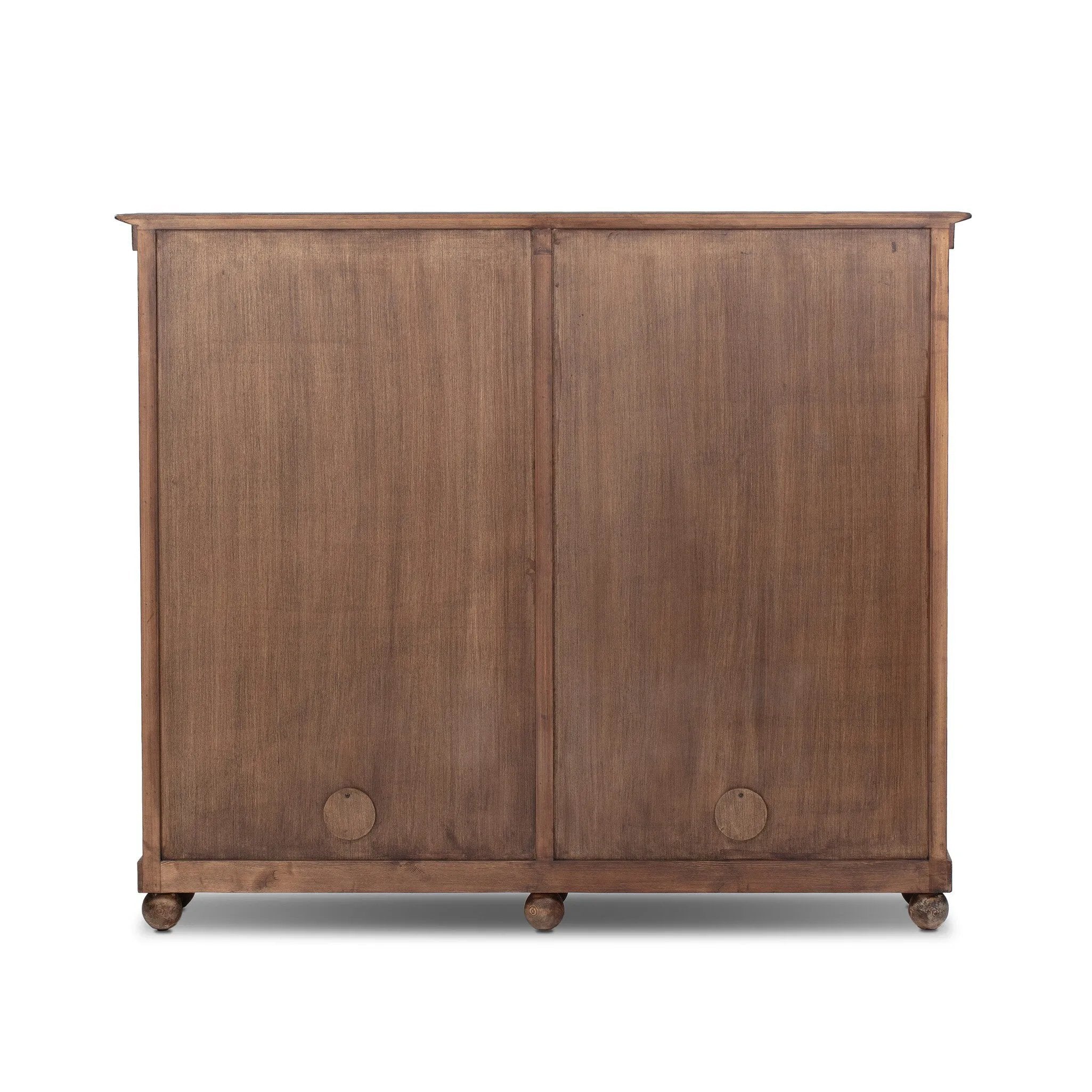 Taking after an antique from China, this inspired cabinet features overlapping double doors and rounded accents. Crafted from solid pine and veneers in a distressed finish for a rustic look Amethyst Home provides interior design, new home construction design consulting, vintage area rugs, and lighting in the Austin metro area.