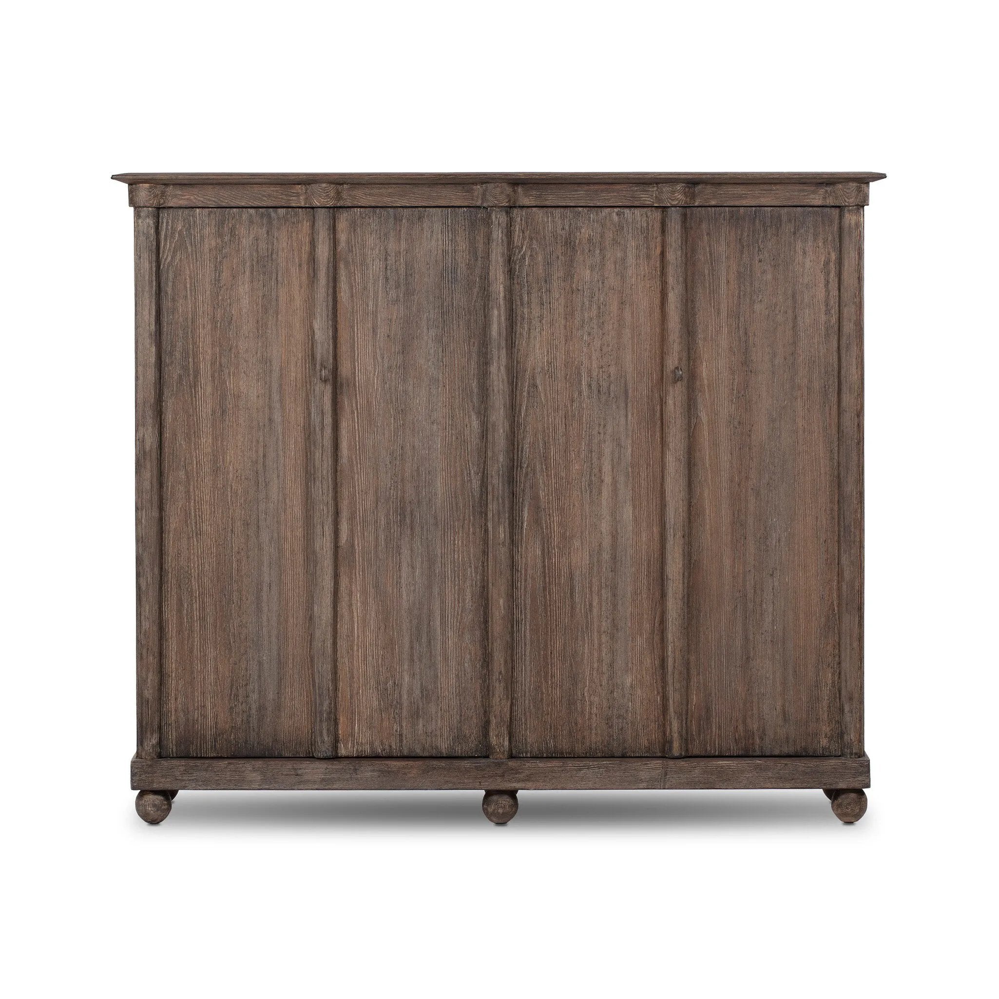 Taking after an antique from China, this inspired cabinet features overlapping double doors and rounded accents. Crafted from solid pine and veneers in a distressed finish for a rustic look Amethyst Home provides interior design, new home construction design consulting, vintage area rugs, and lighting in the Nashville metro area.