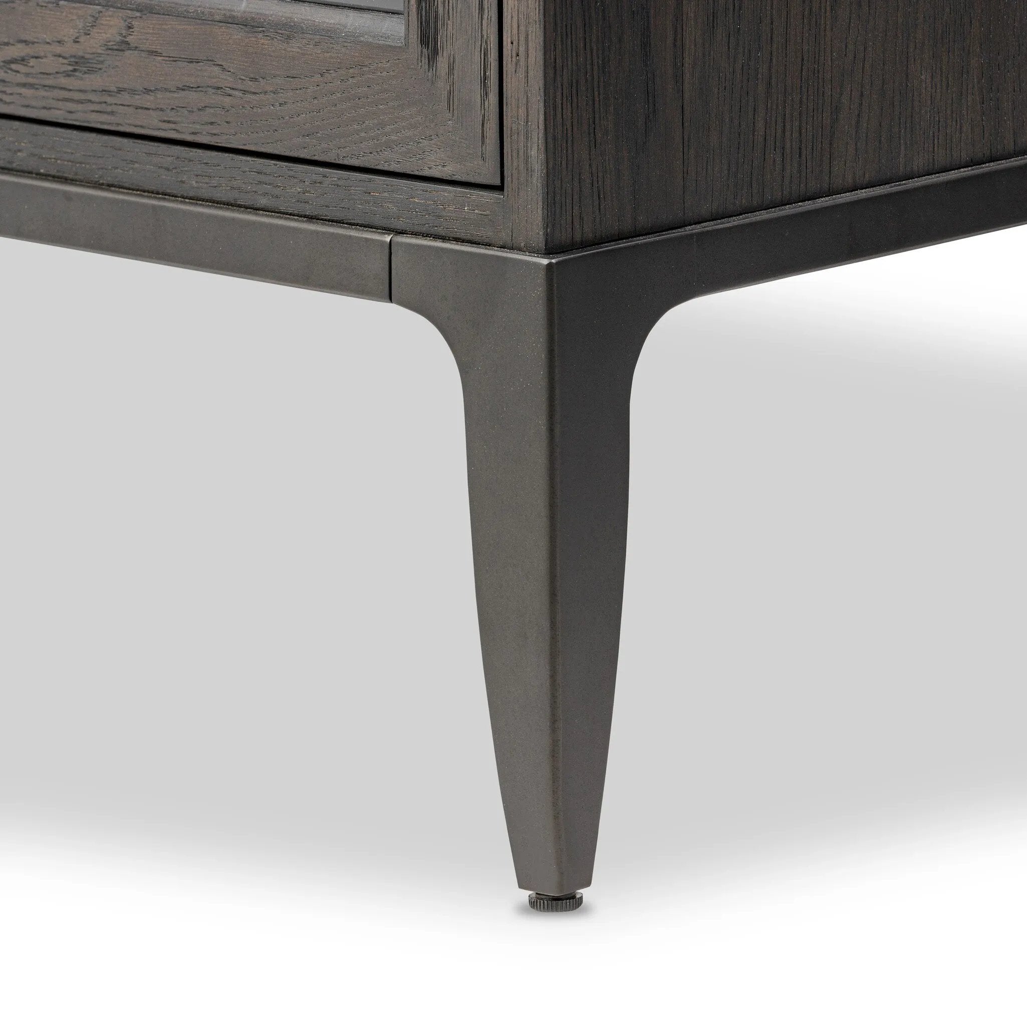 Baroque-period detailing gives this oak cabinet its  classic look. Made from black oak with a metal base and ring pulls, as well as cabriole-like legs to soften the lines Amethyst Home provides interior design, new home construction design consulting, vintage area rugs, and lighting in the Boston metro area.