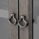 Baroque-period detailing gives this oak cabinet its  classic look. Made from black oak with a metal base and ring pulls, as well as cabriole-like legs to soften the lines Amethyst Home provides interior design, new home construction design consulting, vintage area rugs, and lighting in the Charlotte metro area.