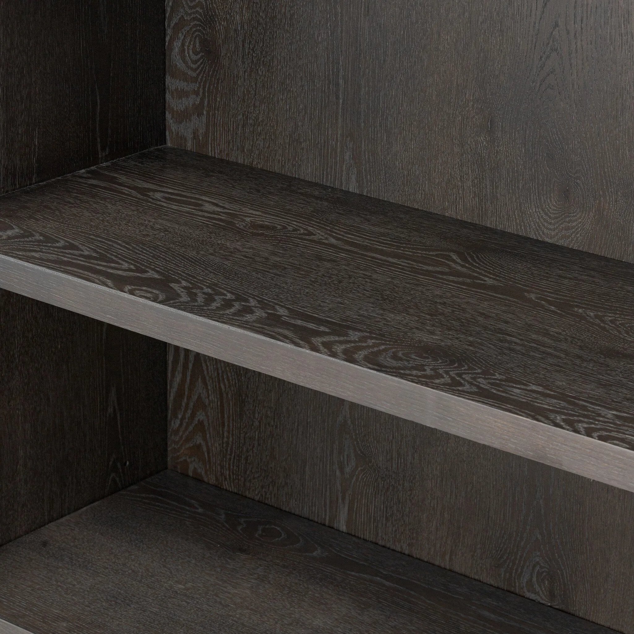 Baroque-period detailing gives this oak cabinet its  classic look. Made from black oak with a metal base and ring pulls, as well as cabriole-like legs to soften the lines Amethyst Home provides interior design, new home construction design consulting, vintage area rugs, and lighting in the Washington metro area.