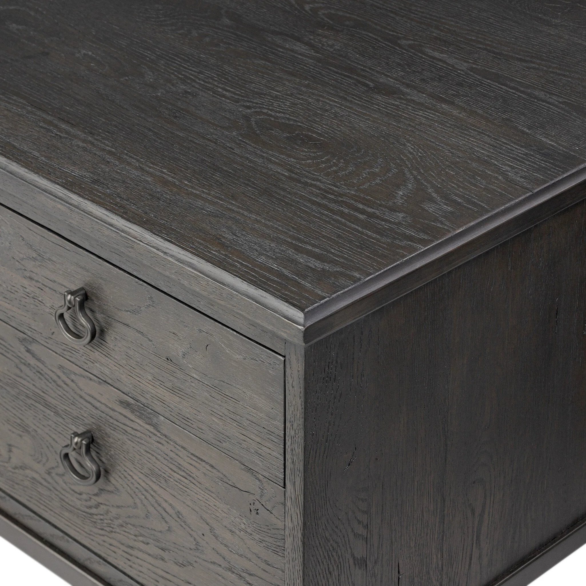 Baroque-period detailing gives this oak desk its  classic look. Made from worn black oak with metal ring pulls on its four drawers, as well as cabriole-like legs to soften the lines Amethyst Home provides interior design, new home construction design consulting, vintage area rugs, and lighting in the Portland metro area.