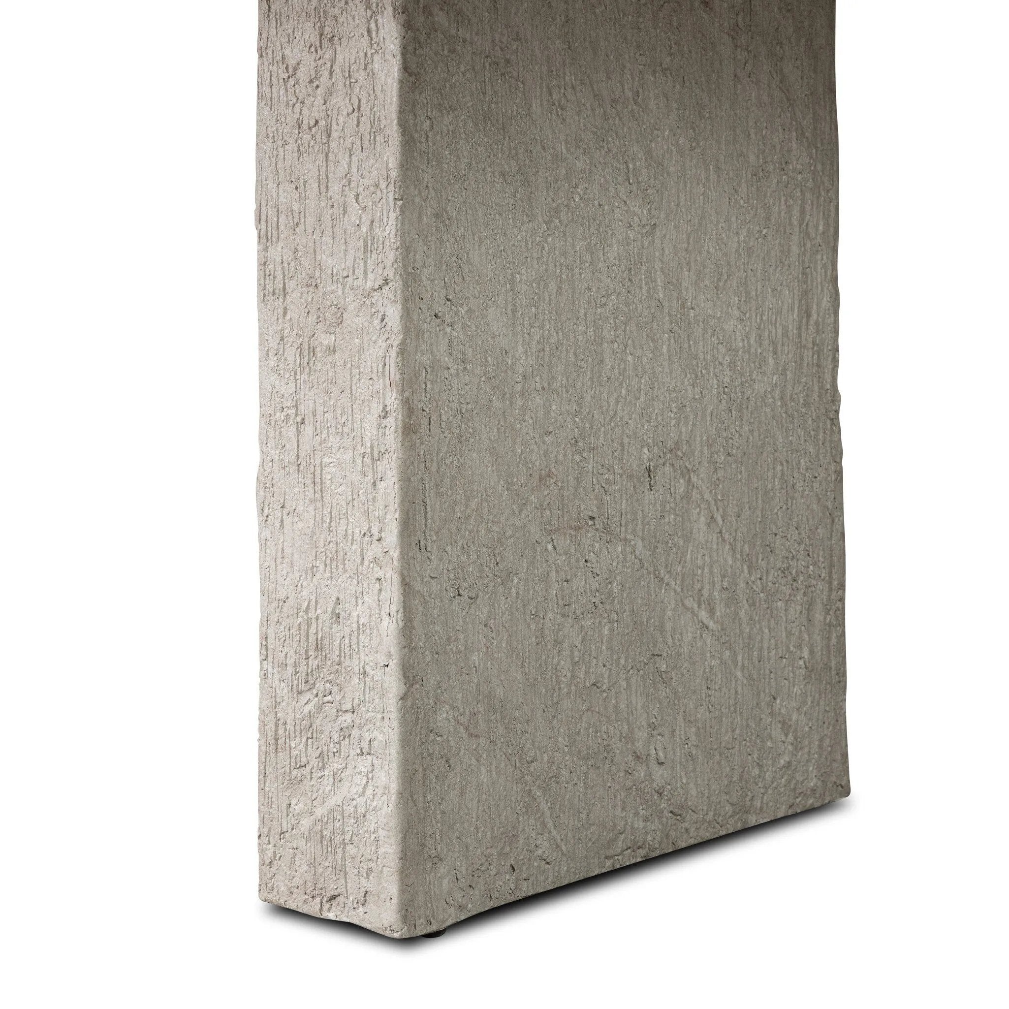 This outdoor dining table features a double pedestal silhouette that's defined by striking contrast between a smooth, refined top and heavily textured legs for a look that's straight from the quarry. It comes together with a water transfer technique on concrete that mimics natural marble. Amethyst Home provides interior design, new home construction design consulting, vintage area rugs, and lighting in the Los Angeles metro area.