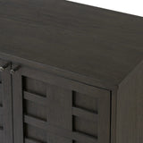 A transitional piece that works into your collection with ease. This solid oak sideboard is finished in a smoked black, highlighting natural graining inherent to rich character woods. Grid-like patterned doors bring dimension to clean, simple shaping, while interior shelving awaits storage of dinnerware, table linens and more. Amethyst Home provides interior design, new home construction design consulting, vintage area rugs, and lighting in the Dallas metro area.