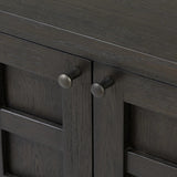 A transitional piece that works into your collection with ease. This solid oak sideboard is finished in a smoked black, highlighting natural graining inherent to rich character woods. Grid-like patterned doors bring dimension to clean, simple shaping, while interior shelving awaits storage of dinnerware, table linens and more. Amethyst Home provides interior design, new home construction design consulting, vintage area rugs, and lighting in the Kansas City metro area.